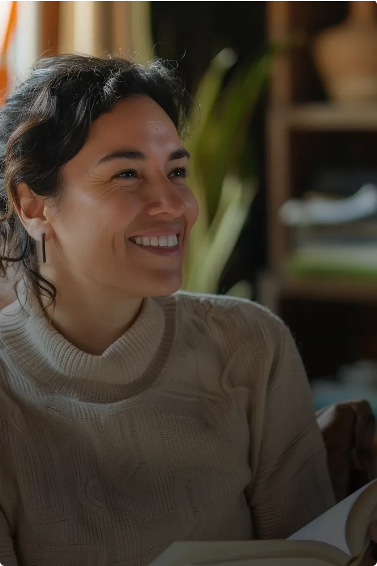 therapist smiling with a book